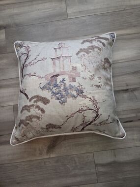 This decorative throw pillow is made from Magnolia Fabric's "Ippsie Spa" textile